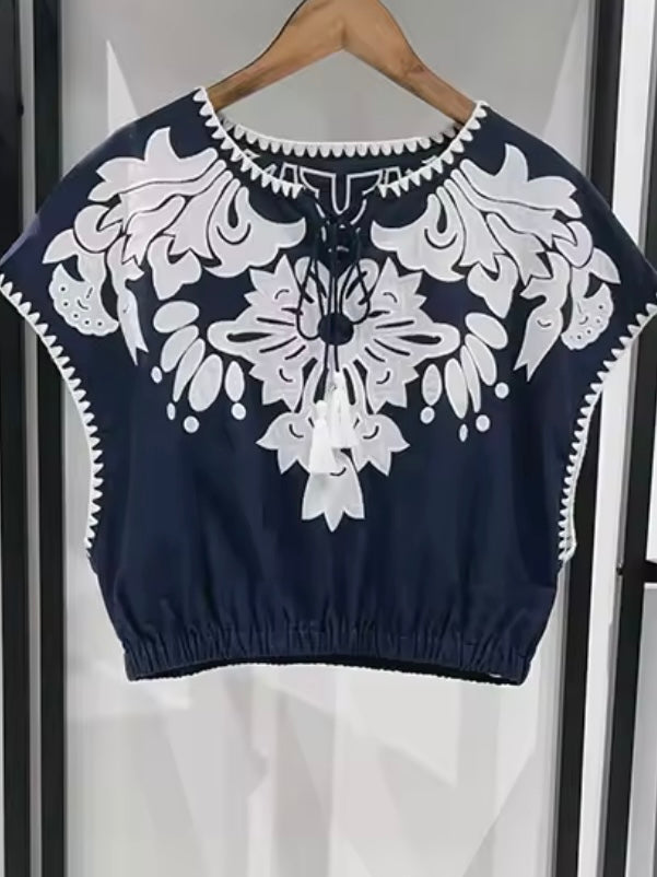 Blue set top and skirt with floral embroidered details