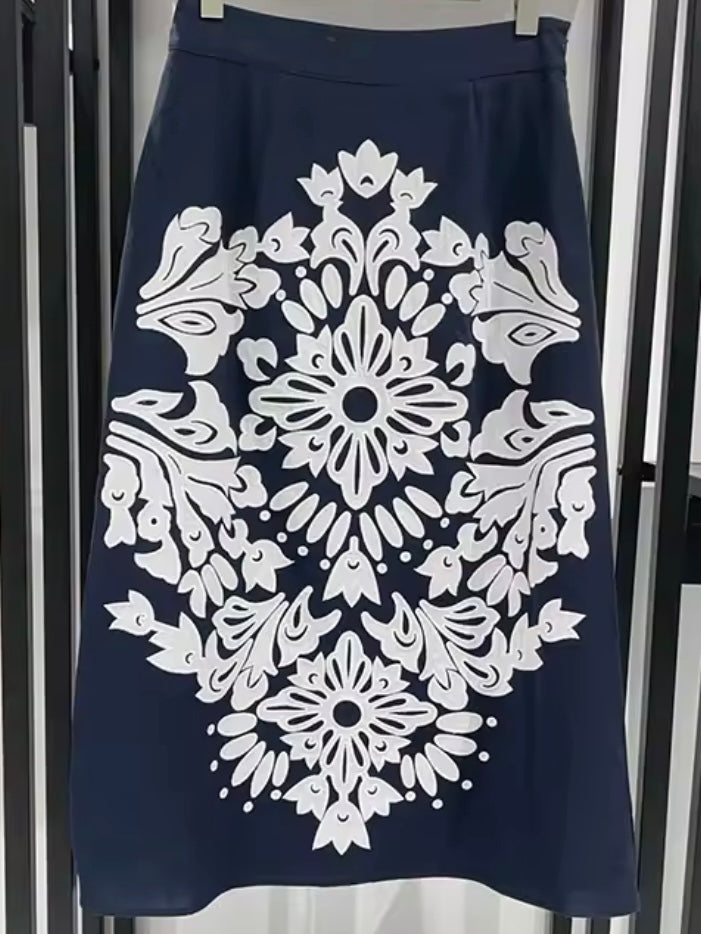 Blue set top and skirt with floral embroidered details