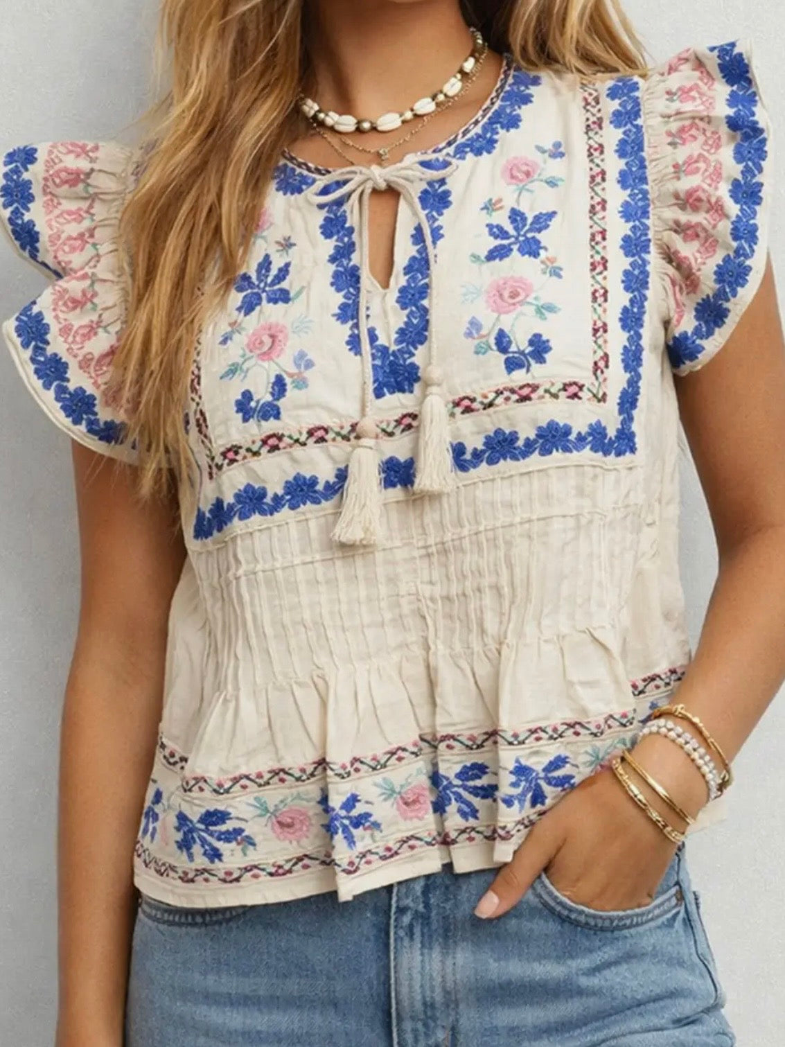 Beige embroidered floral ruffled sleeveless top