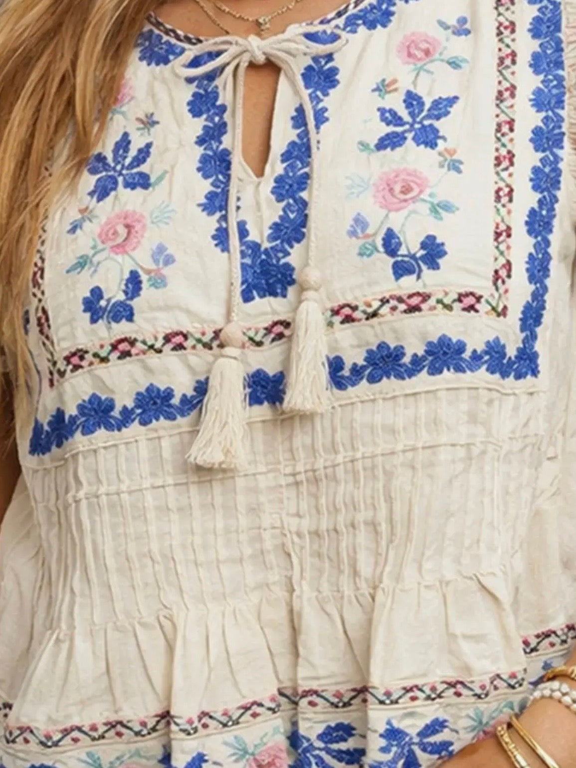 Beige embroidered floral ruffled sleeveless top