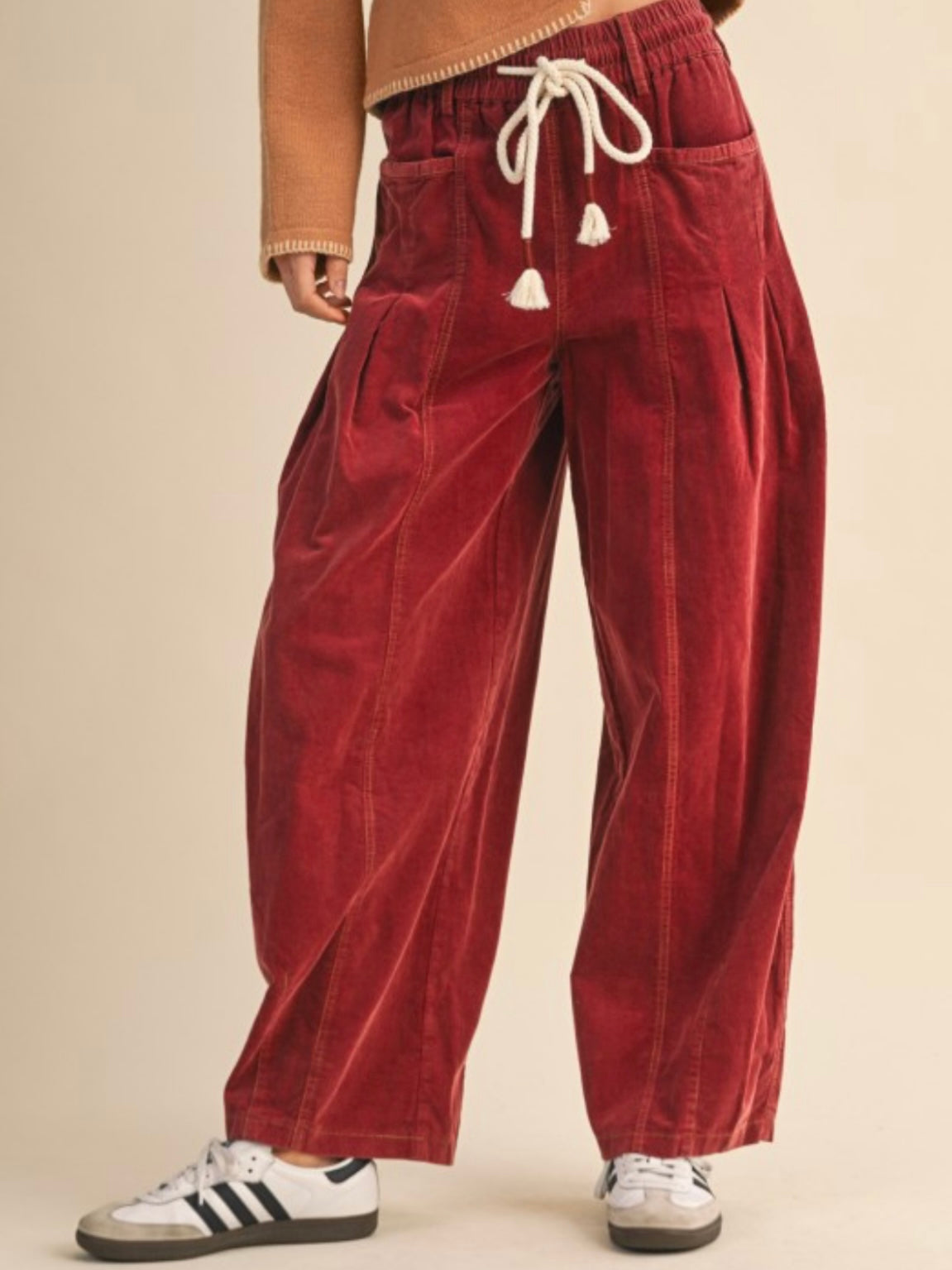 Red washed pleated corduroy barrel pants