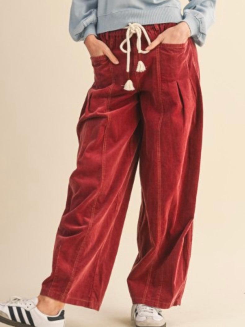 Red washed pleated corduroy barrel pants