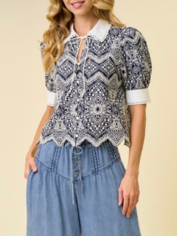 Navy and white embroidered woven fabric with intricate allover pattern