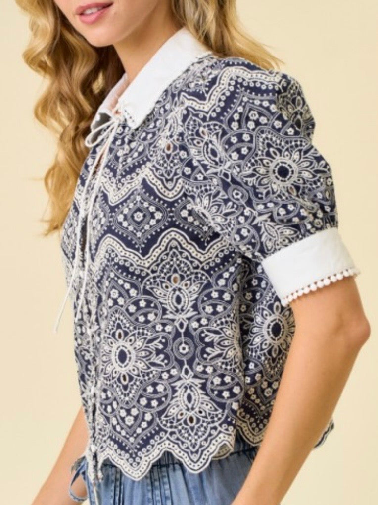 Navy and white embroidered woven fabric with intricate allover pattern