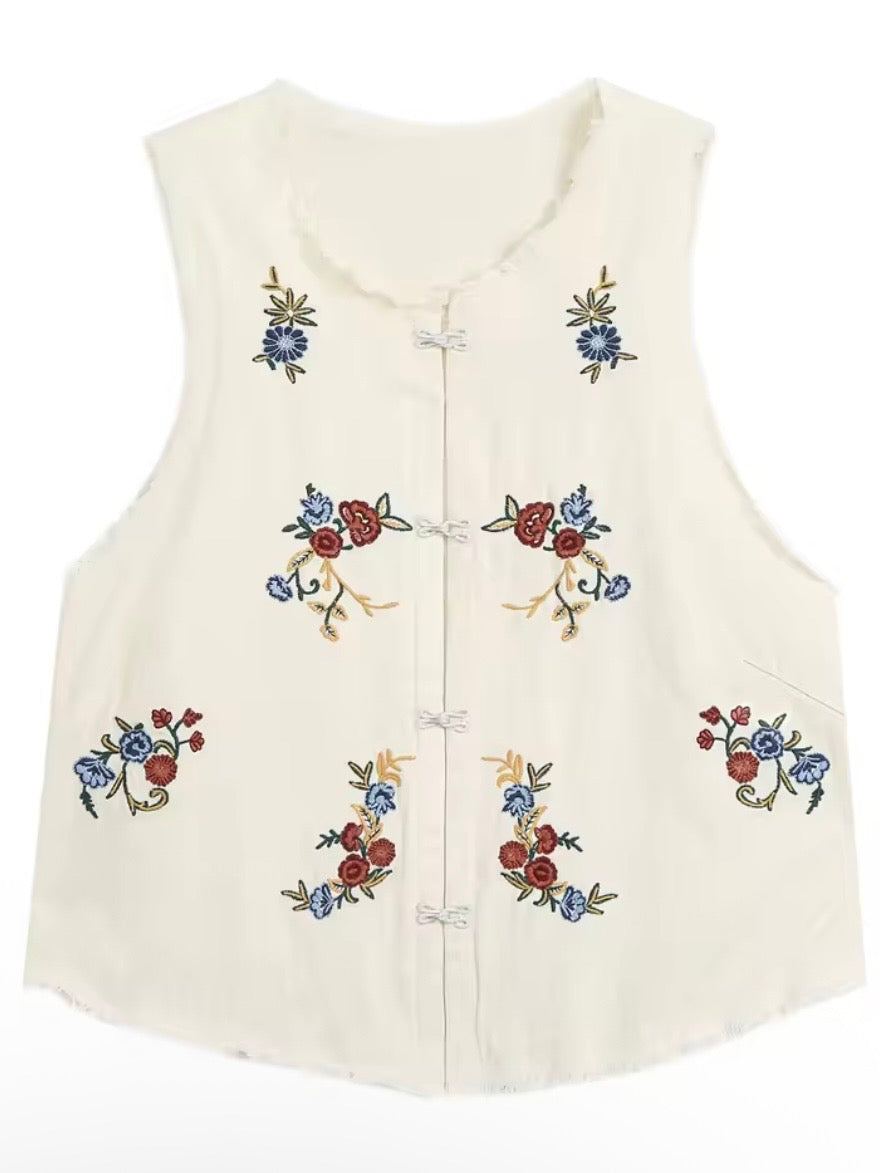 Conjunto de top y pantalones con detalle floral en color blanco hueso y rojo