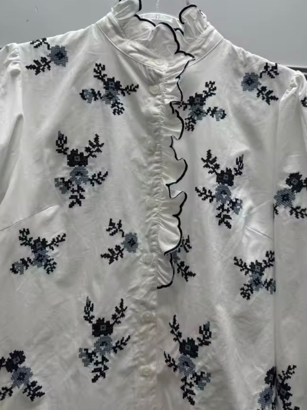 White and blue floral ruffled shirt