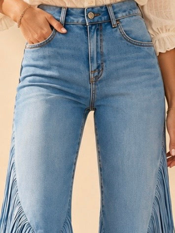 Light blue high-rise flared jeans with long fringe