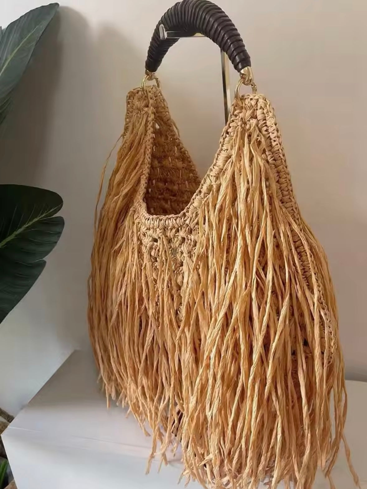 Brown straw hairy handbag