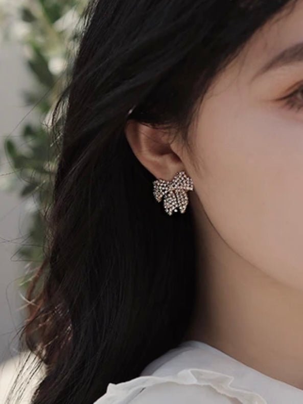 Golden plated bow plated net earrings - Wapas