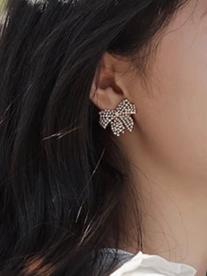 Golden plated bow plated net earrings - Wapas