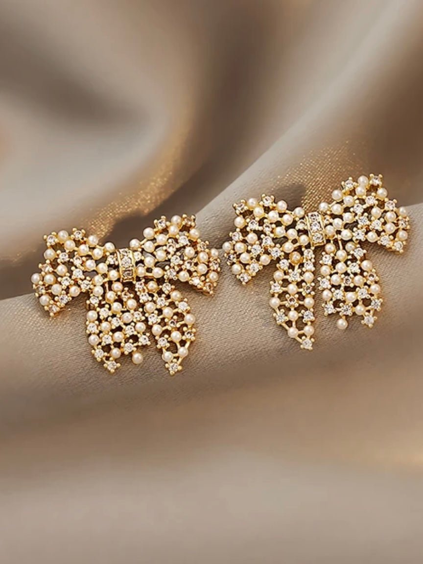 Golden plated bow plated net earrings - Wapas