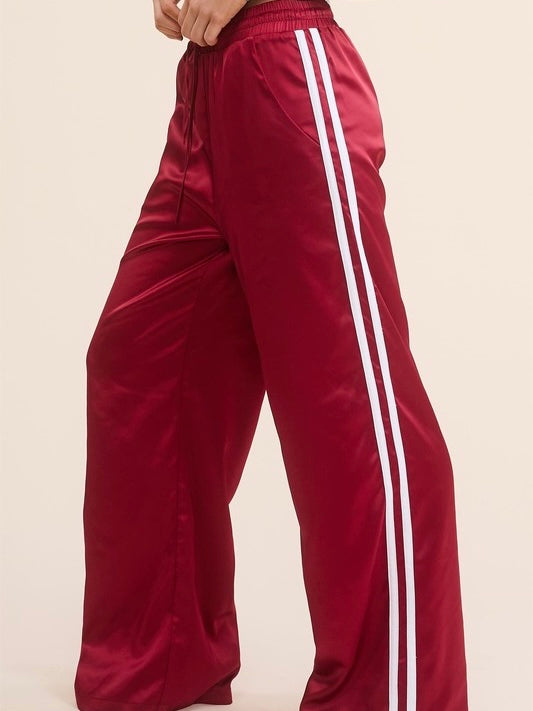 Sporty Satin effect track pants with stripes