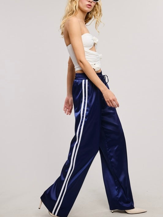 Sporty Satin effect track pants with stripes