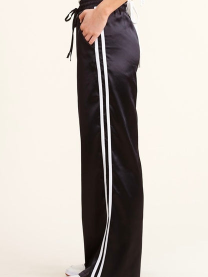 Sporty Satin effect track pants with stripes