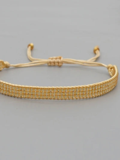 Gold and black heart. Set of 3 pieces, ring and braided bracelets