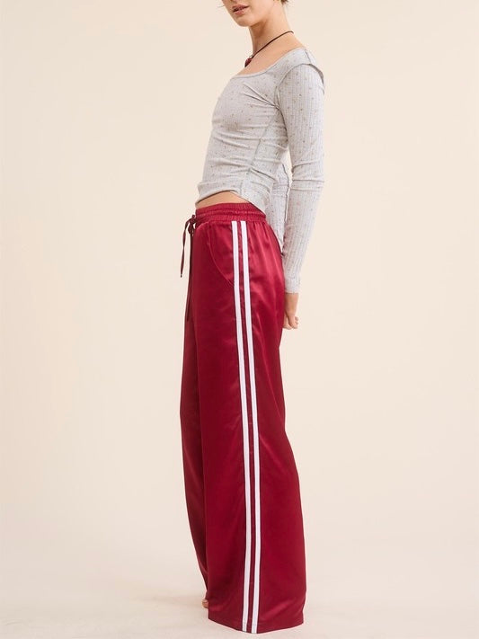 Sporty Satin effect track pants with stripes