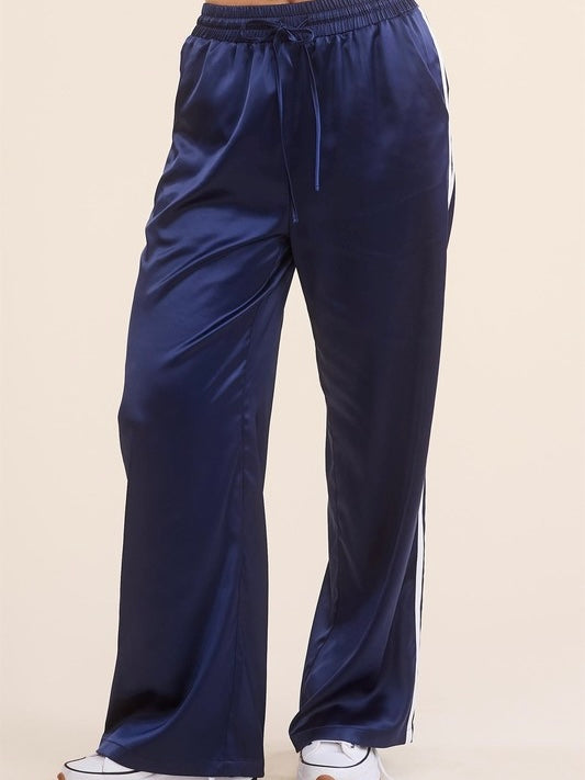 Sporty Satin effect track pants with stripes