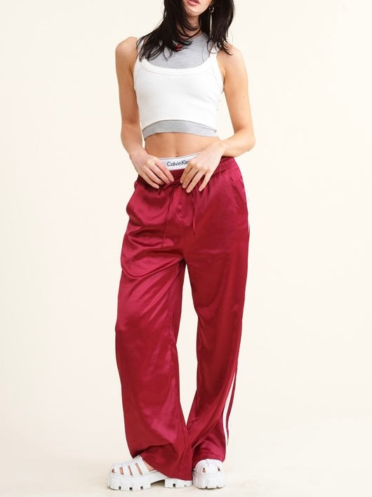 Sporty Satin effect track pants with stripes