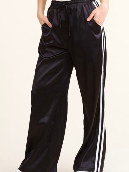 Sporty Satin effect track pants with stripes