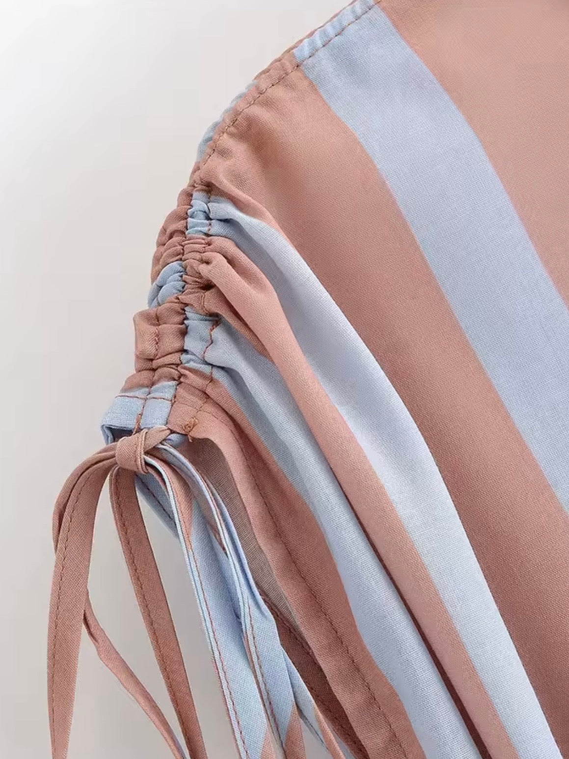 Light brown and light blue striped buttons down sleeveless shirt top