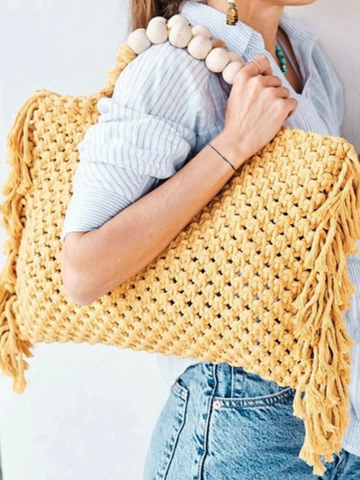 Yellow knitted tassels bag