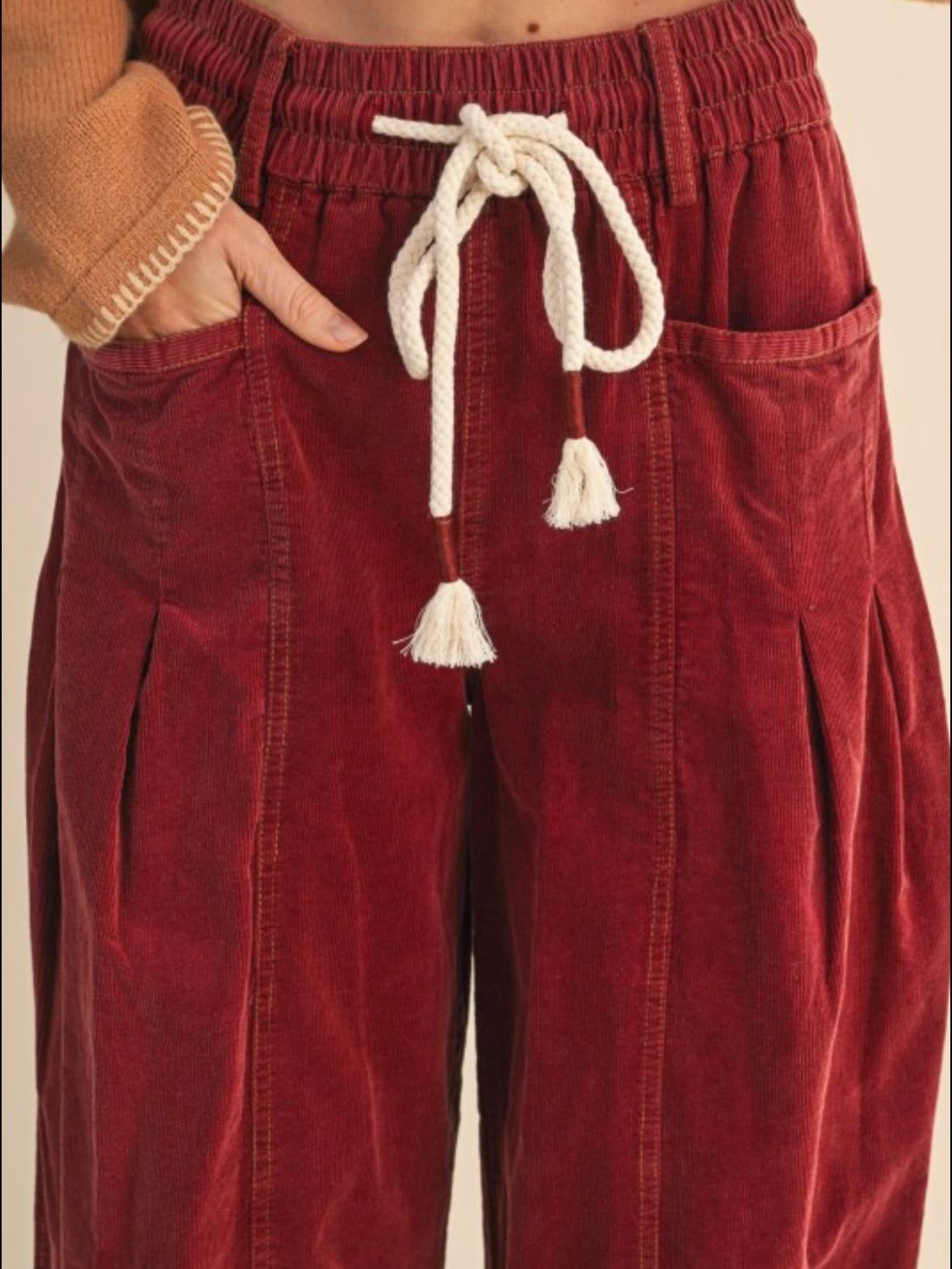Red washed pleated corduroy barrel pants