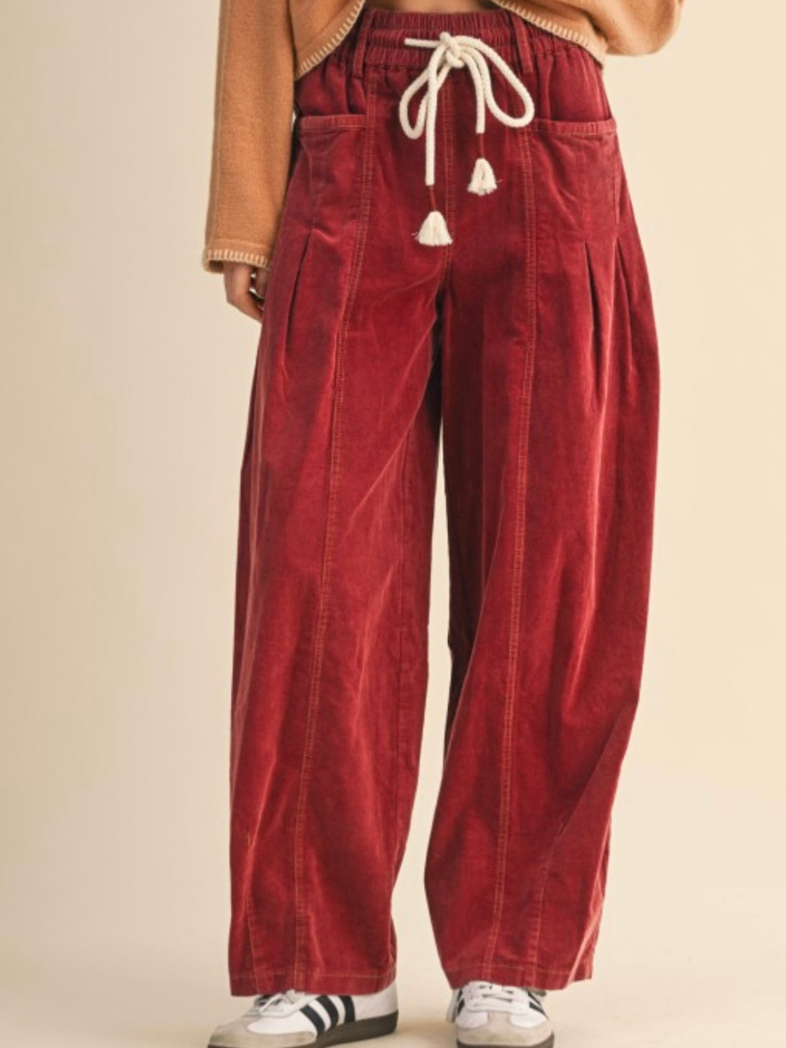 Red washed pleated corduroy barrel pants
