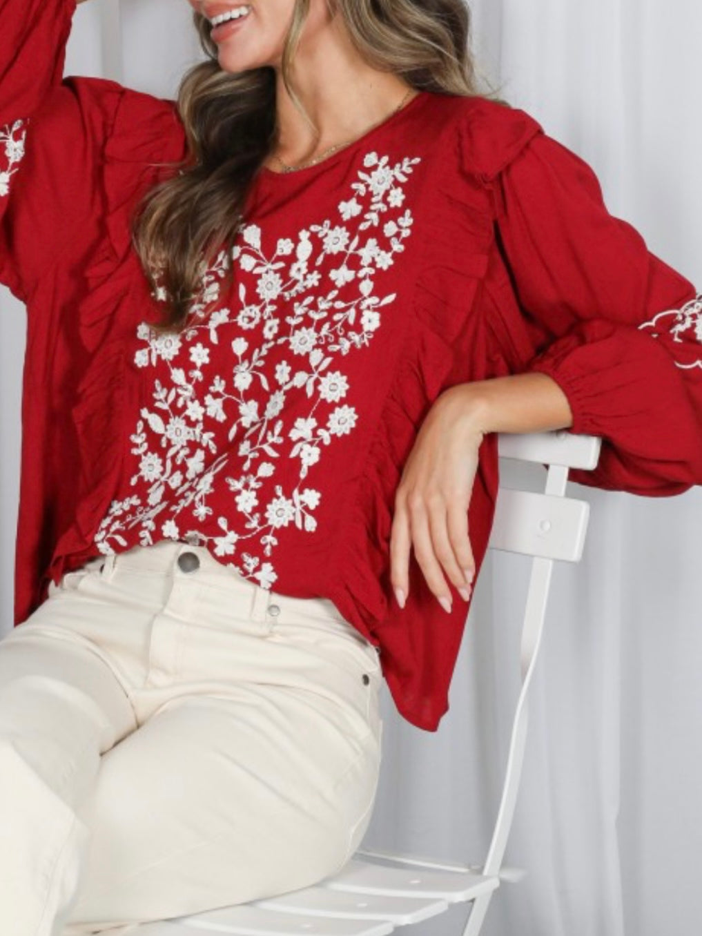 Red and white embroidered floral blouse