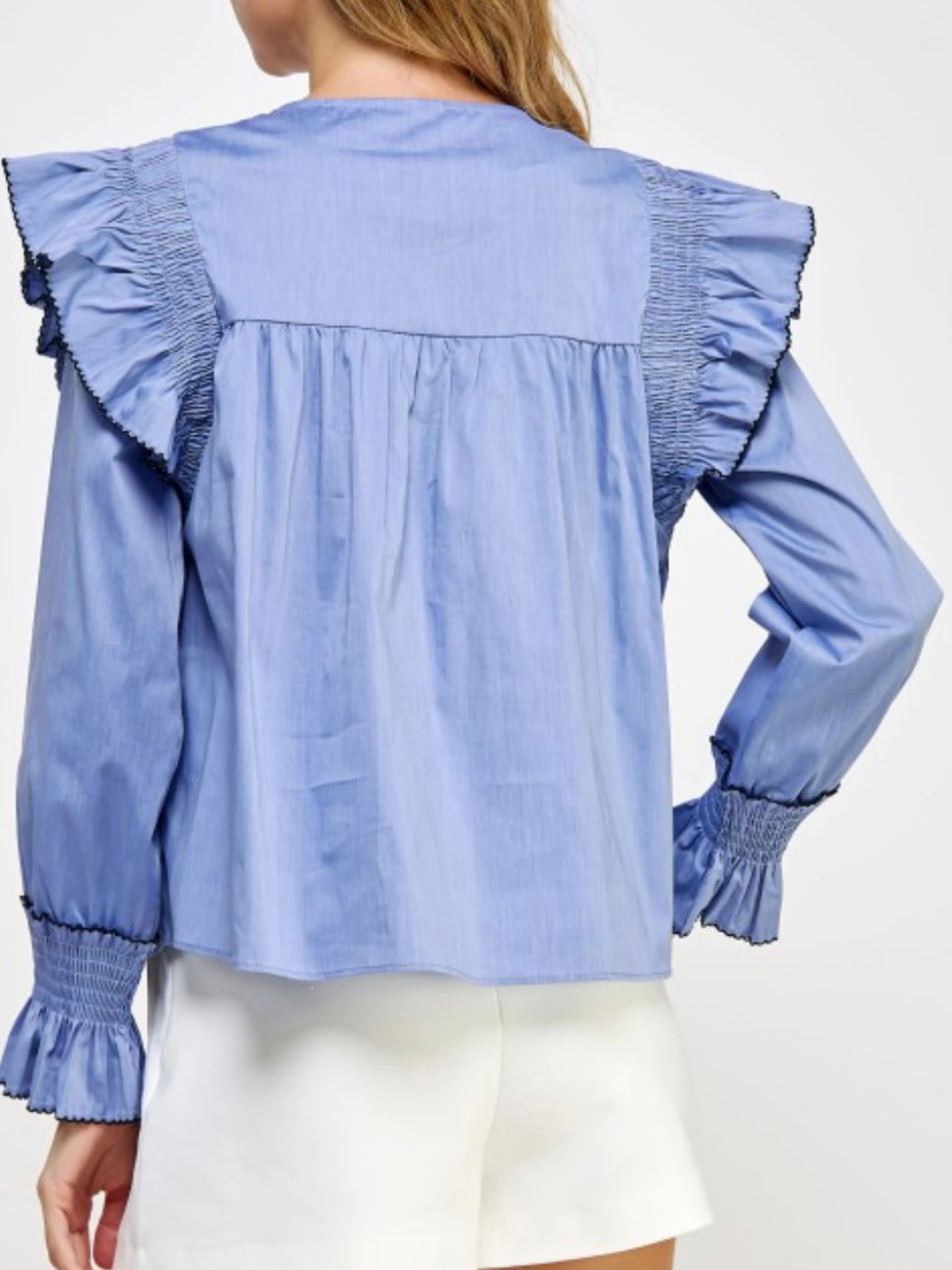 Light blue ruffled shirt