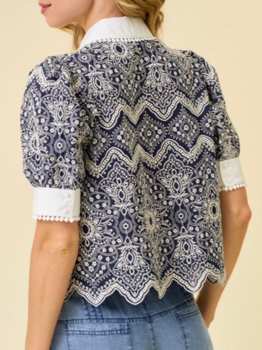 Navy and white embroidered woven fabric with intricate allover pattern