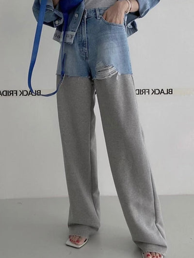 Blue jeans detail and gray pants