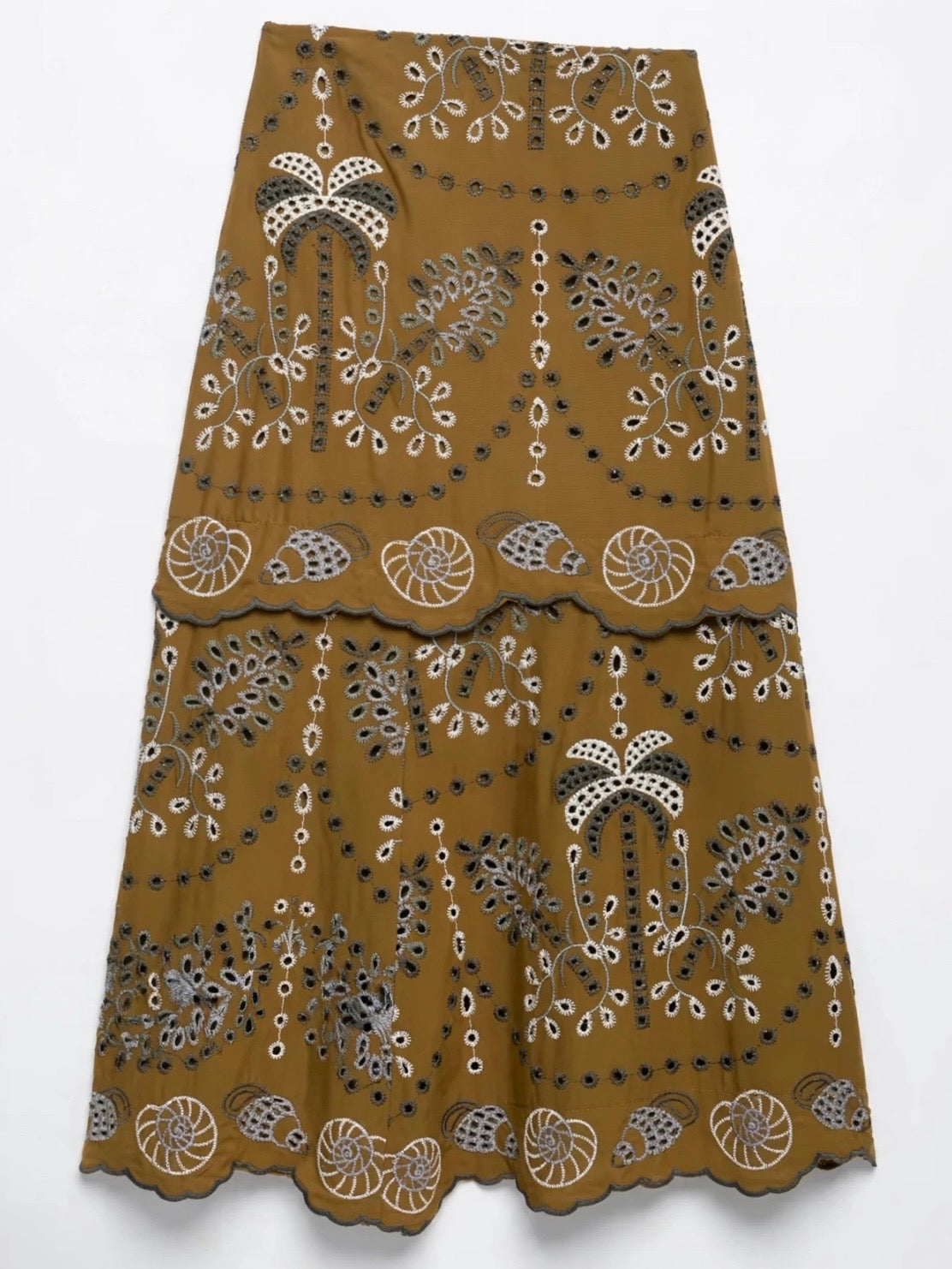 Conjunto de dos piezas de encaje con ojales en color marrón, beige y azul: top y falda midi