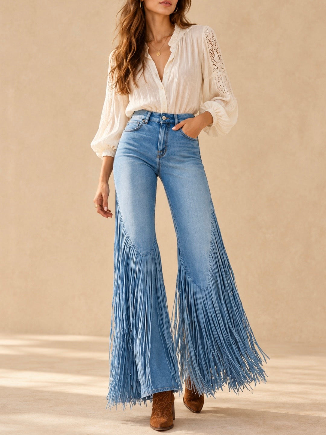 Light blue high-rise flared jeans with long fringe