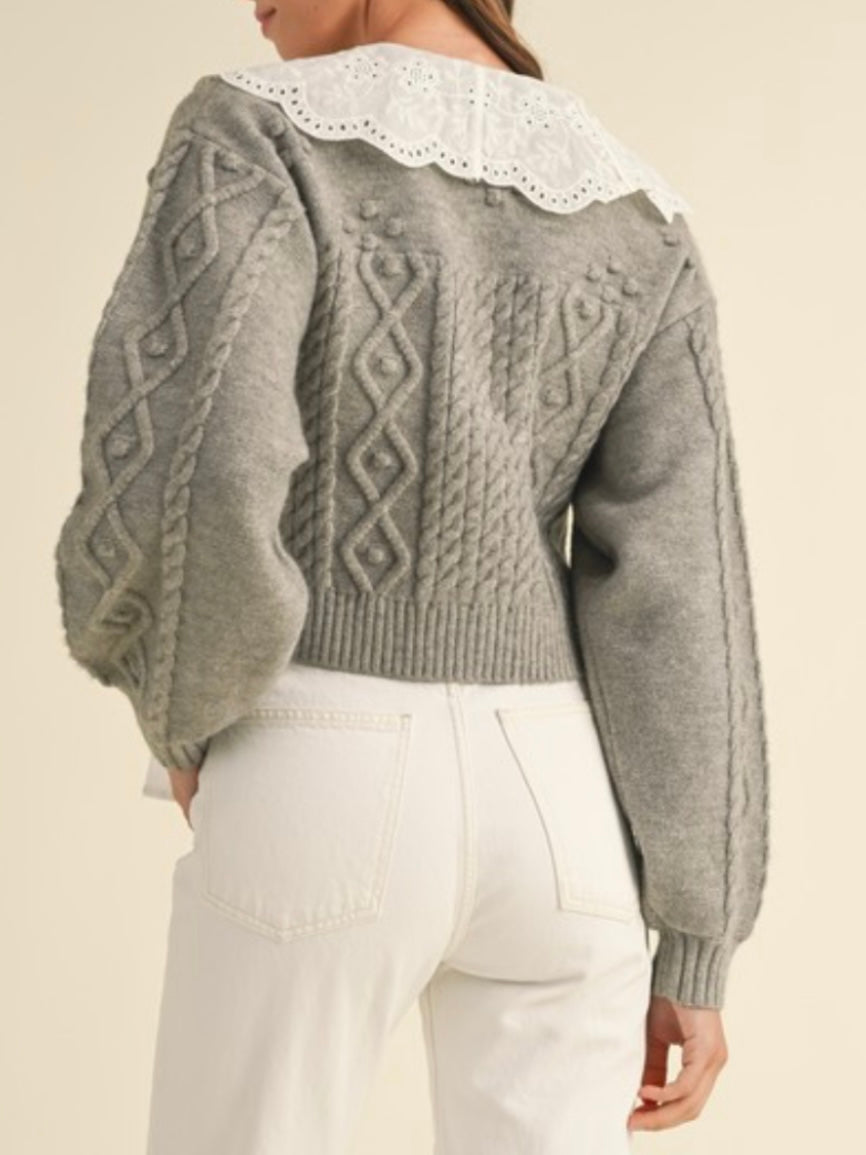 Gray and white knitted sweater