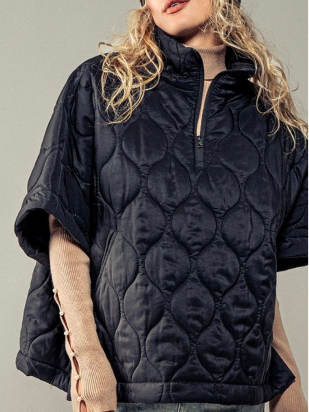 Black quilted oversize vest