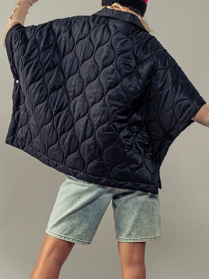 Black quilted oversize vest