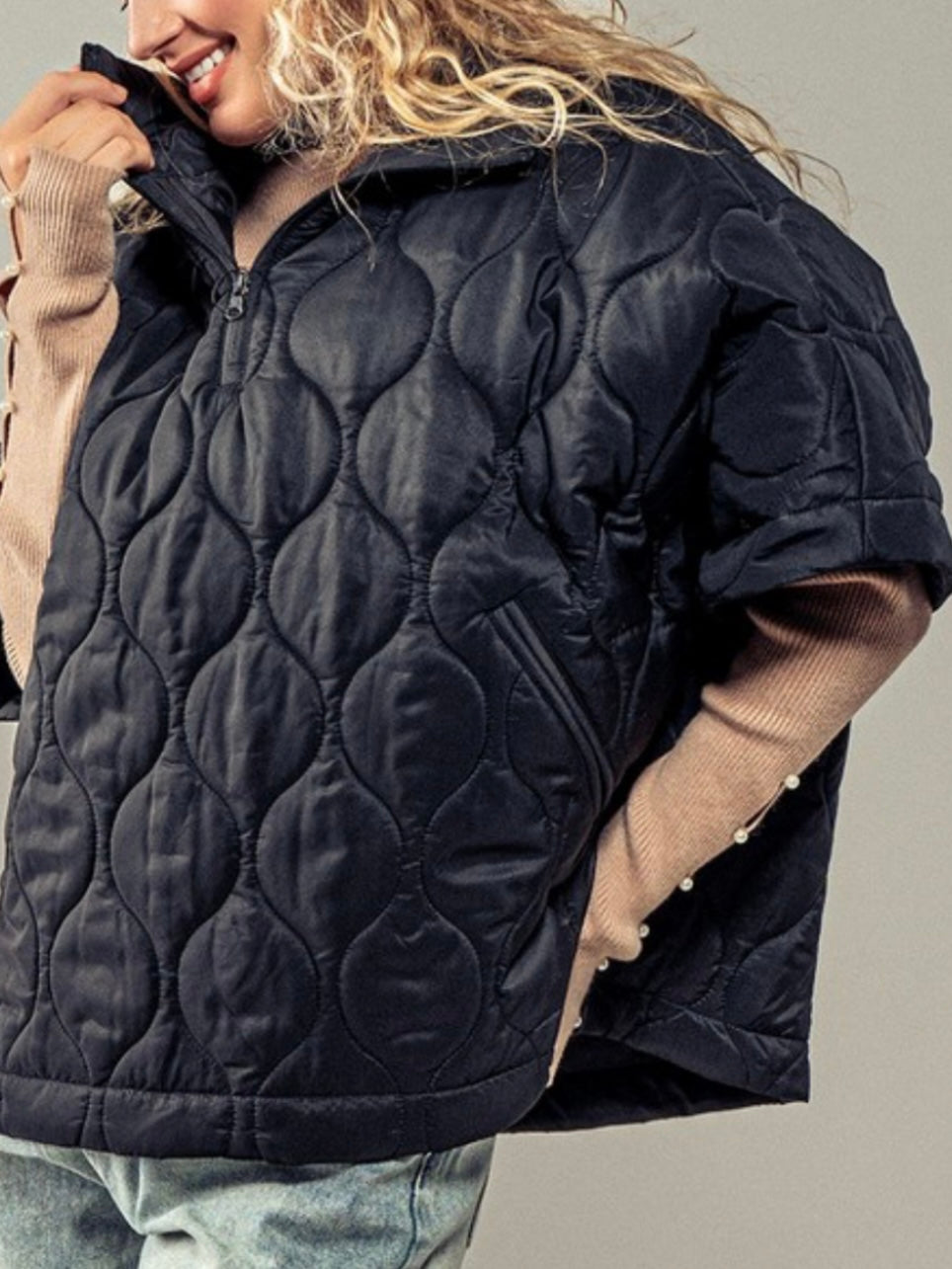 Black quilted oversize vest