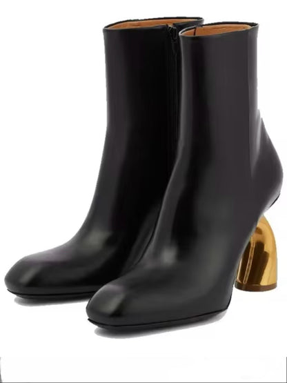 Black faux leather and golden arch high heel boots