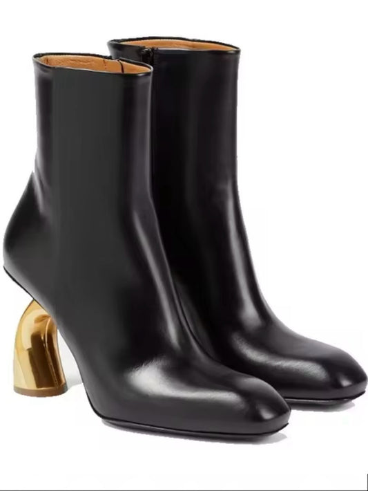 Black faux leather and golden arch high heel boots