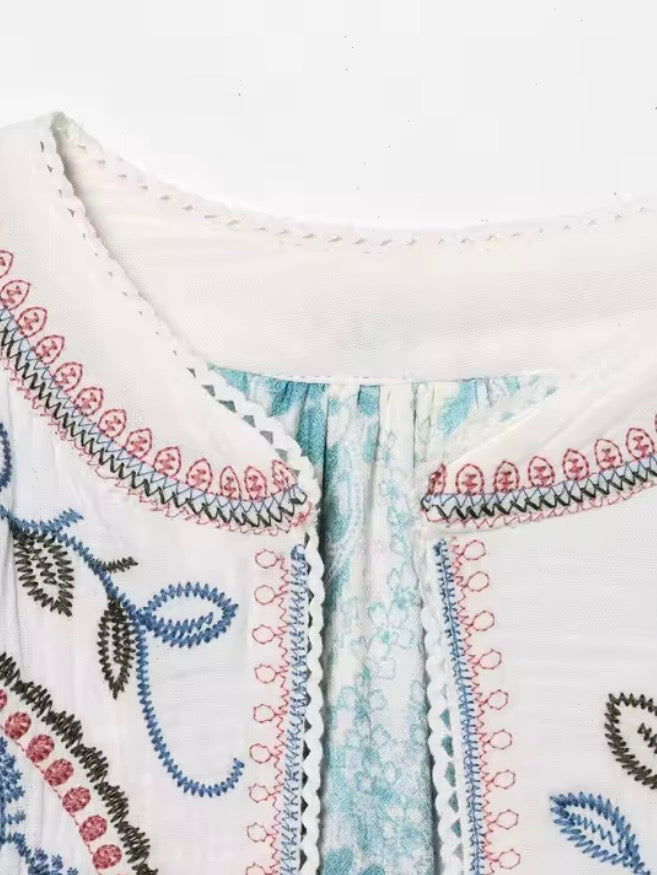 White embroidered red and blue details short sleeves crop top