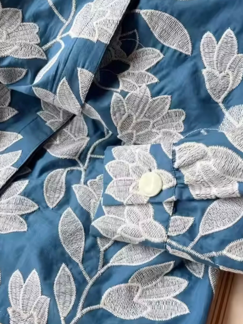 Light blue and white embroidered floral shirt