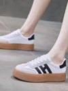 White and black platform lace up sneakers