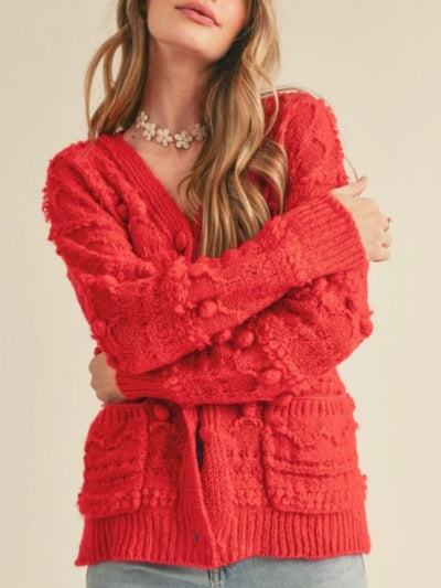 Red open pom-poms cardigan sweater