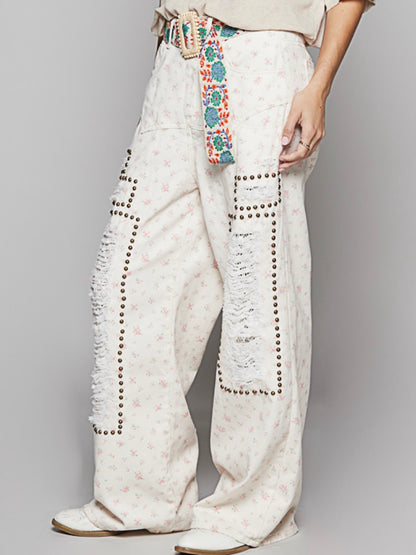 Beige floral print distressed studded pants