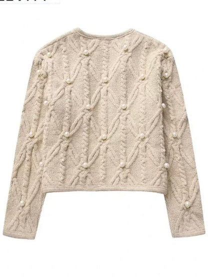 Beige knitted pearls with texture sweater