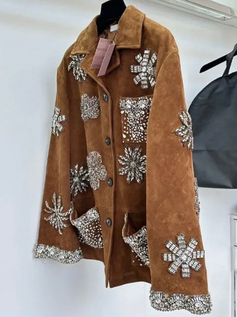 Brown leather jacket with floral details