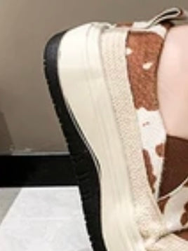 Brown and white cow print platform straps sneakers