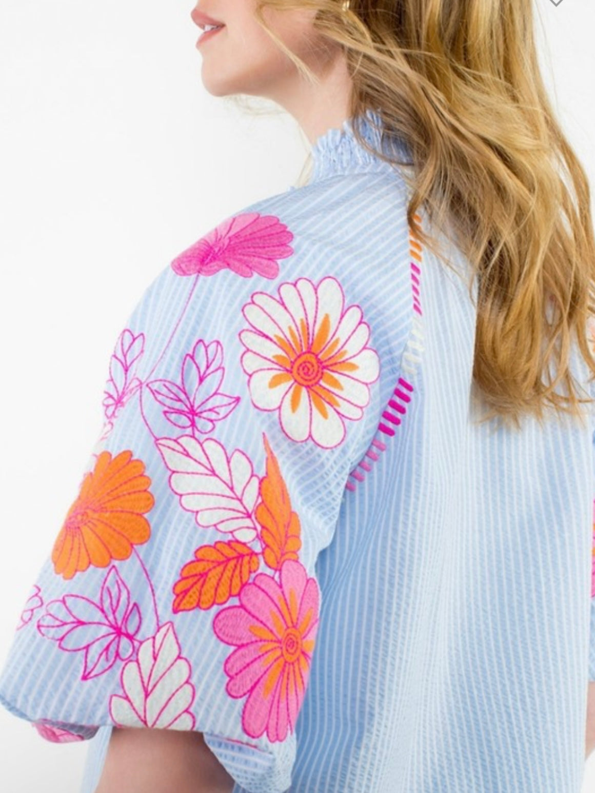 Light blue striped and pink embroidered floral texture top