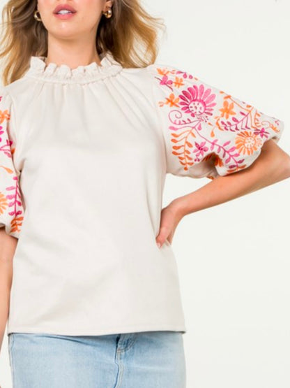 White and fuchsia embroidered floral texture top