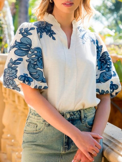 White and blue embroidered floral texture top